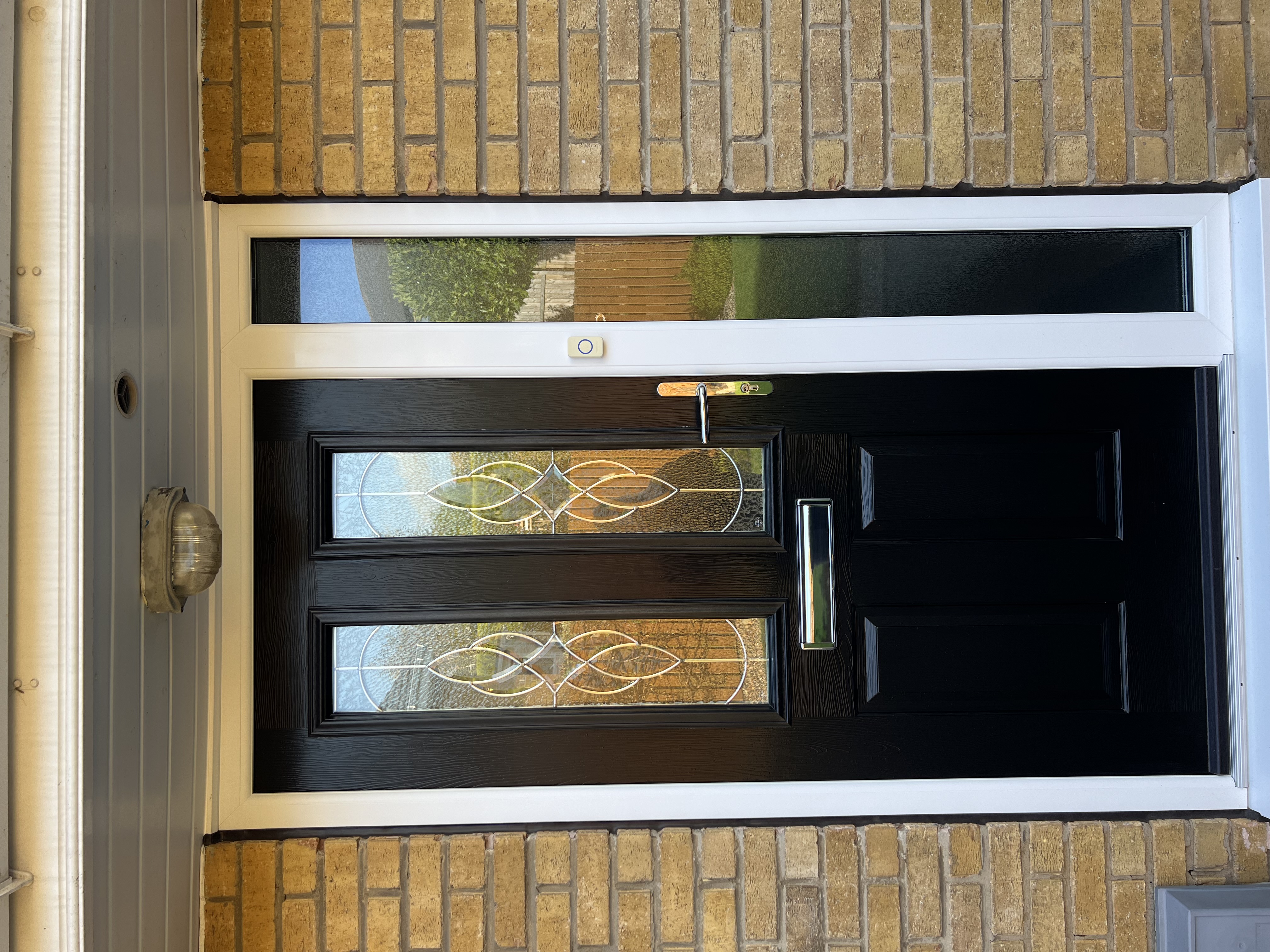 Black and white Ludlow composite door with elegance glass